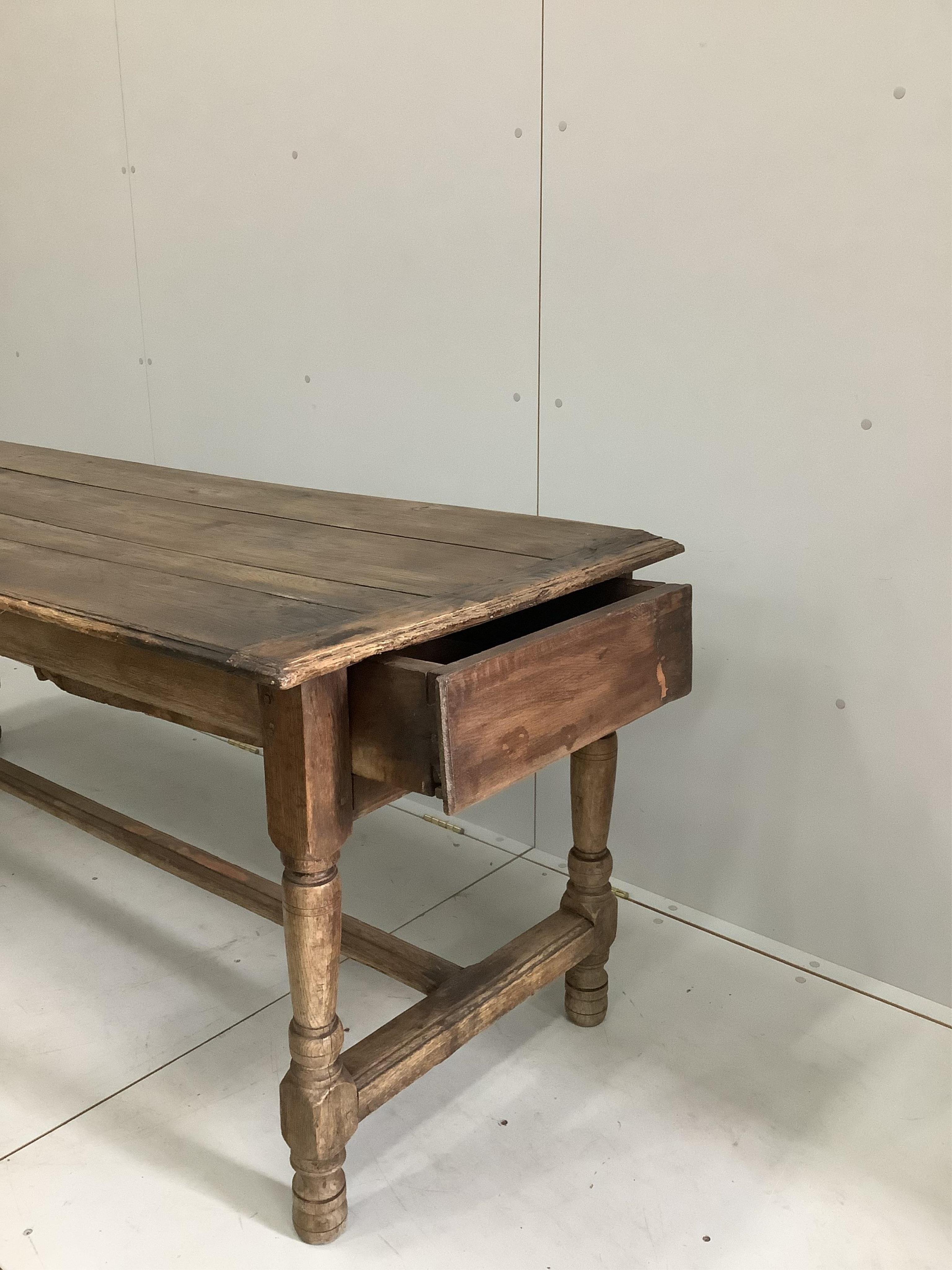 An 18th century French refectory dining table with one drawer, width 195cm, depth 72cm, height 75cm